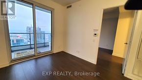 Vaughan (Vaughan Corporate Centre) condo for rent - A room with a view of the city through large windows.