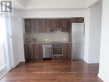 Toronto (Agincourt South-Malvern West) condo for rent - A kitchen with wooden cabinets and stainless steel appliances.