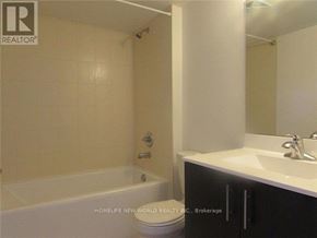 Toronto (Agincourt South-Malvern West) condo for rent - A bathroom with a tub, sink and mirror.