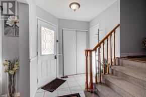 Oshawa (Pinecrest) apartment for rent - A hallway with a staircase and a door.