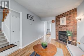 Oshawa (Pinecrest) apartment for rent - A living room with a fireplace and a couch.