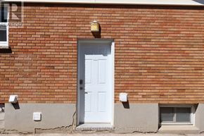 London North (North N) apartment for rent - A white door is on the left side of a brick wall.