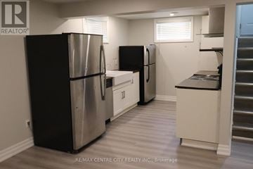 London North (North N) apartment for rent - A kitchen with two refrigerators and a stainless steel counter.