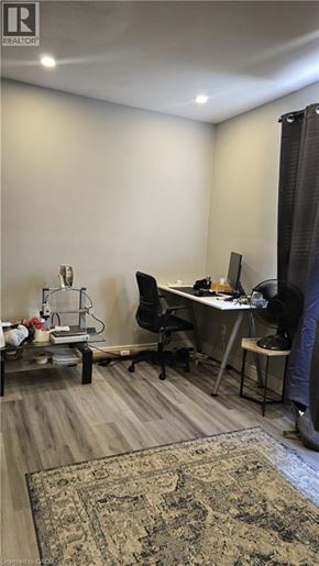 Hamilton condo for rent - A room with a desk, chair, and computer setup.