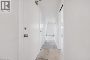Kitchener apartment for rent - A hallway with a door on the left and a door on the right.