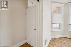 Hamilton apartment for rent - A white door is in a room with a window.