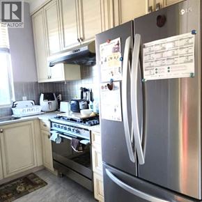 Richmond apartment for rent - A kitchen with a stove, oven, and refrigerator.