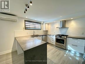 Toronto (Weston-Pellam Park) fourplex for rent - A modern kitchen with a granite countertop and stainless steel appliances.