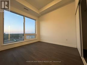 Toronto (Newtonbrook East) condo for rent - A room with a large window overlooking a cityscape.