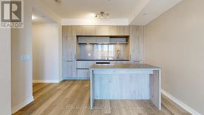 Richmond Hill condo for rent - A kitchen with a wooden island and a window above it.