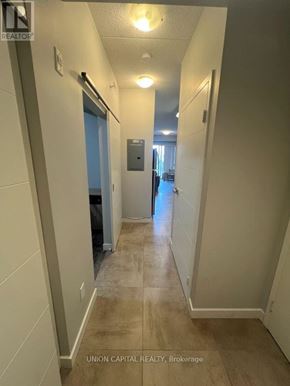 Waterloo condo for rent - A hallway with a door on the left and a door on the right.