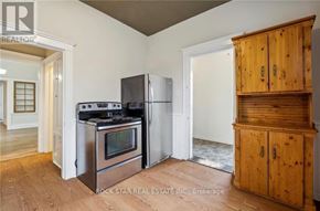 Hamilton (Landsdale) duplex for rent - A kitchen with a stove top oven and a refrigerator.