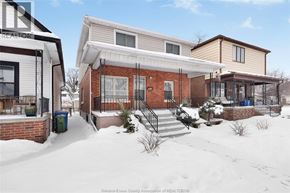 Windsor apartment for rent - A house with a snowy front yard is shown in the image.
