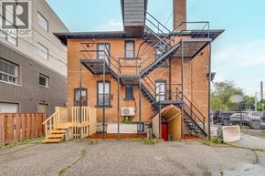 Windsor apartment for rent - A brick house with a fire escape.