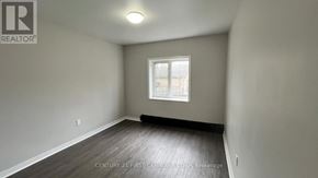 London East (East B) house for rent - A room with a window and a sign on the wall.
