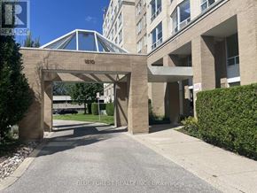 London North (North G) condo for rent - A building with a stone archway and the number 1870 on it.