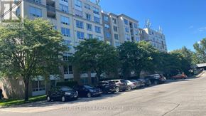London North (North G) condo for rent - A parking lot with cars and apartment buildings.