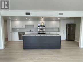 London North (North G) condo for rent - A kitchen with a large island in the middle.