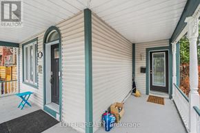 Ottawa apartment for rent - A porch with a blue chair and a box on the floor.