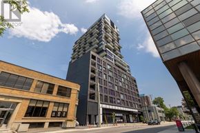 Ottawa condo for rent - A modern building with a glass facade stands tall in the city.