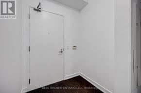 Toronto (Niagara) condo for rent - A white door with a Real Broker logo on it.