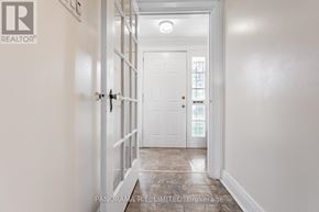 Toronto (Long Branch) apartment for rent - A hallway with a white door and a white wall.