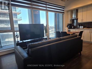Toronto (Banbury-Don Mills) condo for rent - A living room with a couch and a television.
