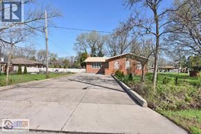 Windsor apartment for rent - A house with a driveway in front of it.