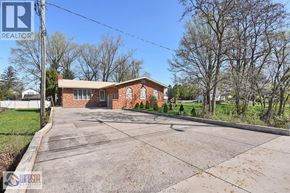 Windsor apartment for rent - A house with a driveway in front of it.