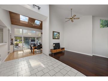Surrey apartment for rent - A living room with a television and a chair.
