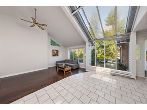 Surrey apartment for rent - A living room with a ceiling fan and a couch.