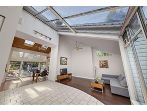 Surrey apartment for rent - A sunny day in a spacious living room with a skylight.