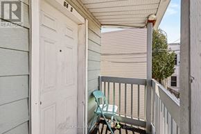 Ottawa condo for rent - A small balcony with a chair and table.