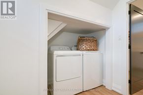 Toronto (Birchcliffe-Cliffside) apartment for rent - A white laundry machine is in a small alcove.