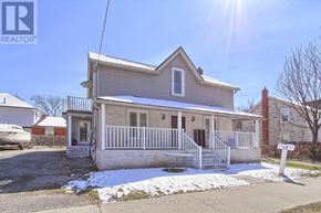 Oshawa (Central) triplex for rent - A house with a realtor logo in the corner.