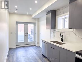 Richmond Hill (Mill Pond) apartment for rent - A modern kitchen with a sink, cabinets, and a window.