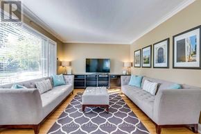 Toronto (Alderwood) apartment for rent - A living room with two couches, a coffee table, and a television.