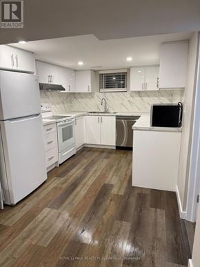 Hamilton (Mohawk) apartment for rent - A kitchen with white appliances and wooden floors.