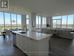 Niagara Falls (Oldfield) condo for rent - A spacious kitchen with a large island and a view of the city.