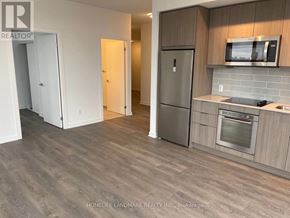 Toronto (Henry Farm) condo for rent - A kitchen with a refrigerator, oven, and microwave.