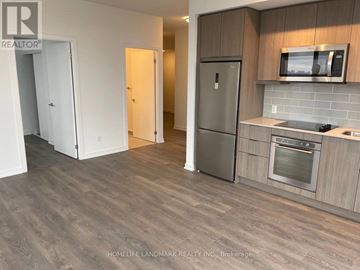 Toronto (Henry Farm) condo for rent - A kitchen with a refrigerator, oven, and microwave.