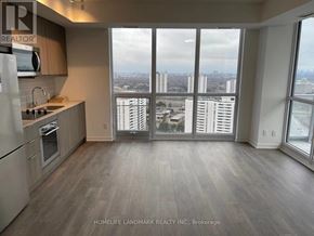 Toronto (Henry Farm) condo for rent - A kitchen with a view of the city.