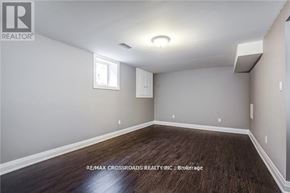Oshawa (Donevan) apartment for rent - A room with a window and a wooden floor.