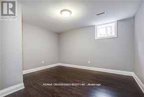 Oshawa (Donevan) apartment for rent - A room with a window and a wooden floor.