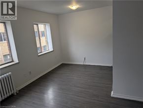 Burlington apartment for rent - A room with a window and a radiator on the wall.