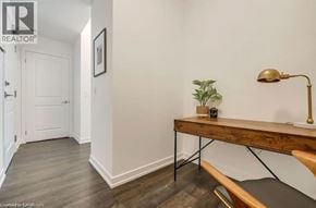 Beamsville condo for rent - A room with a wooden bench and a lamp on the right side.