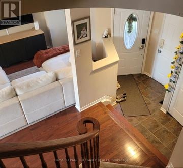 Ottawa townhouse for rent - A living room with a couch and a painting on the wall.