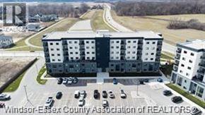 Lasalle condo for rent - A large building with the words "Windsor-Essex County Association of REALTORS" on it.