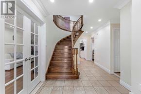 Brampton (Northwood Park) apartment for rent - A wooden staircase with a metal railing leads to a second floor.