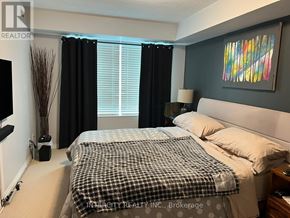 Toronto (Willowridge-Martingrove-Richview) condo for rent - A bedroom with a bed, nightstand, and a painting on the wall.